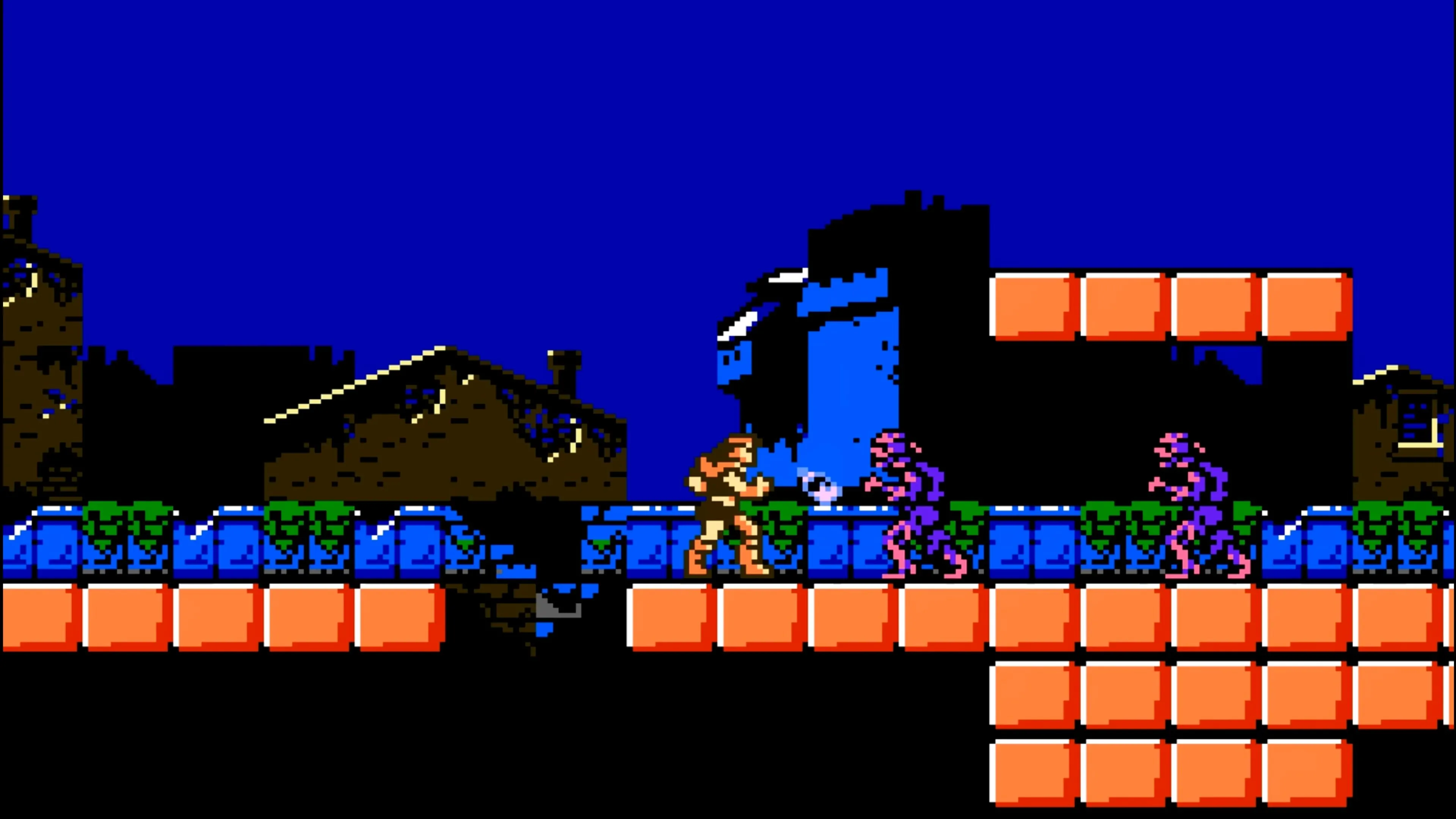 Cảnh chơi game Castlevania III: Dracula's Curse với Trevor Belmont đang chiến đấu với quái vật trong một hang động.