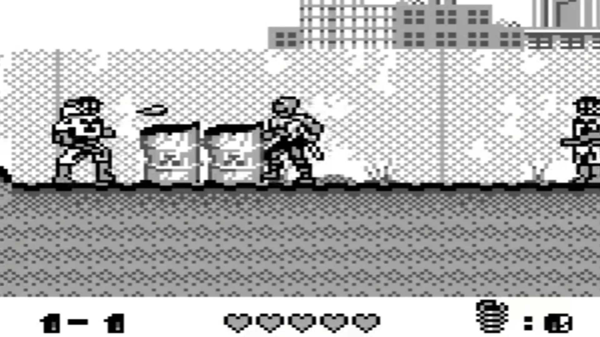 Hình ảnh gameplay của trò chơi Toxic Crusaders trên Game Boy, thể hiện nhân vật Toxie đang chiến đấu.