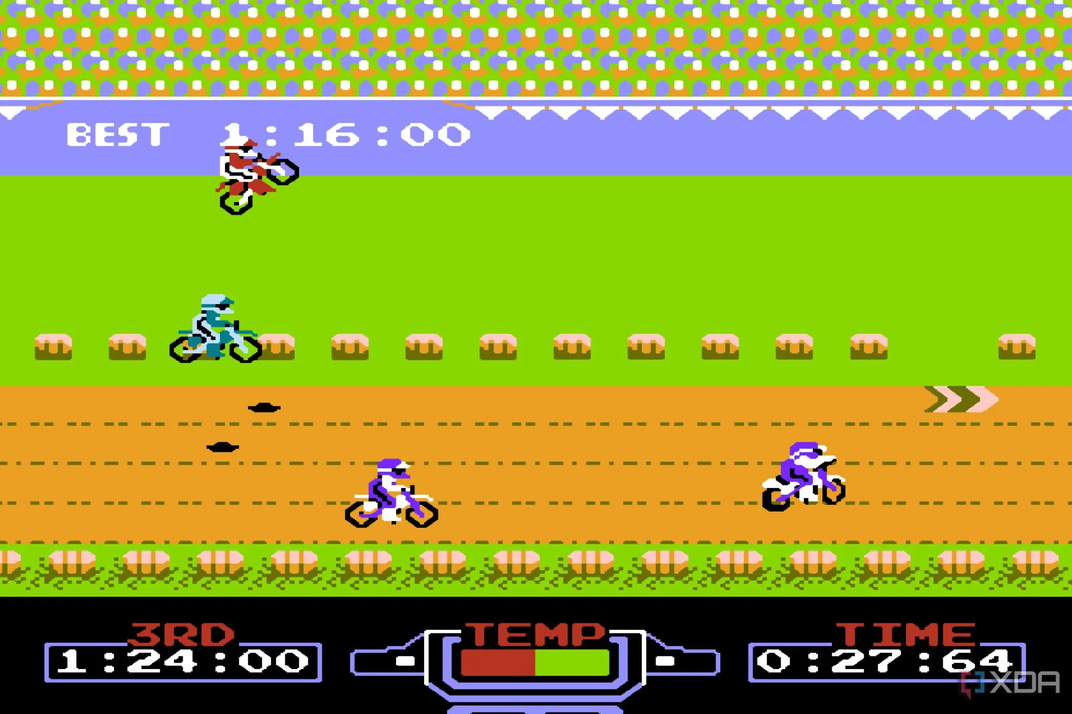 Một chiếc xe mô tô đang thực hiện pha nhảy qua chướng ngại vật trong game Excitebike trên hệ máy Nintendo Entertainment System, với đồ họa pixel cổ điển.