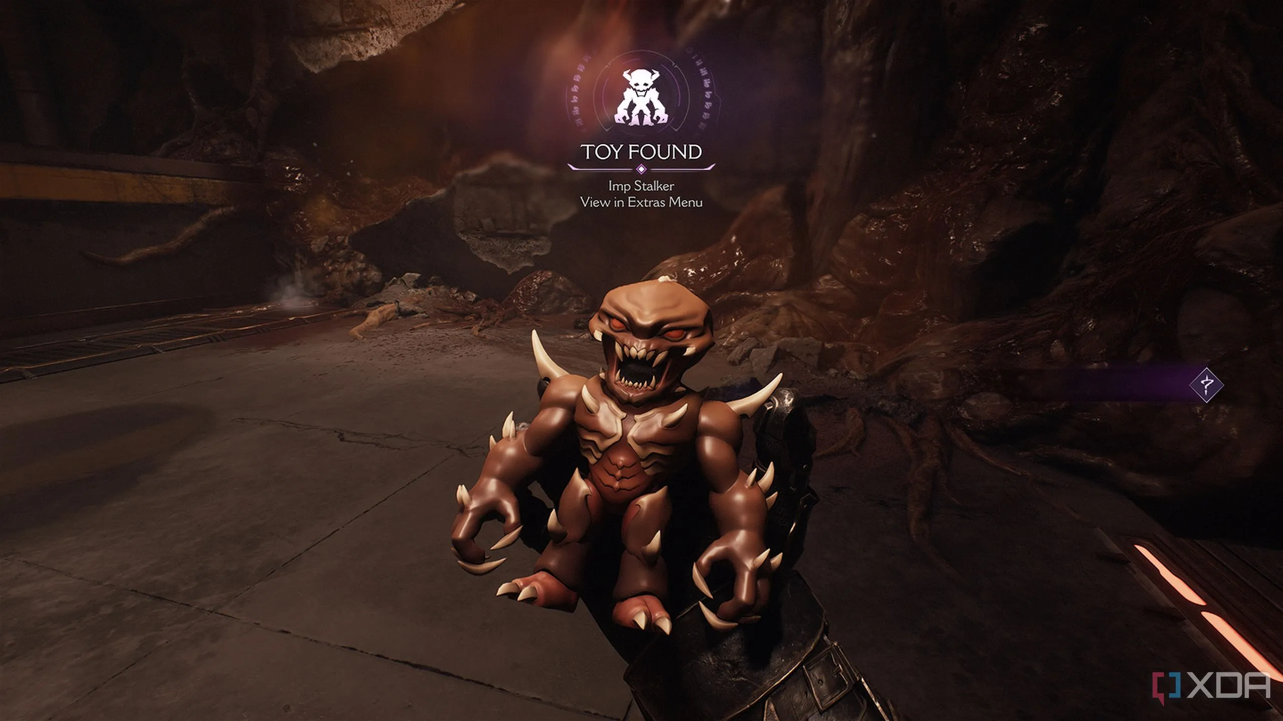 Vật phẩm sưu tầm Đồ chơi Imp Stalker nằm trên bệ trong khu vực bí mật của Doom The Dark Ages Hebeth